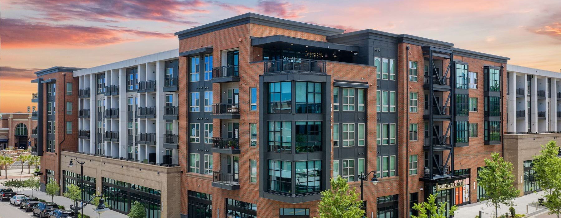 the exterior of a building at sunset