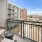 Patio view of the pool deck with lounge chairs and end table 